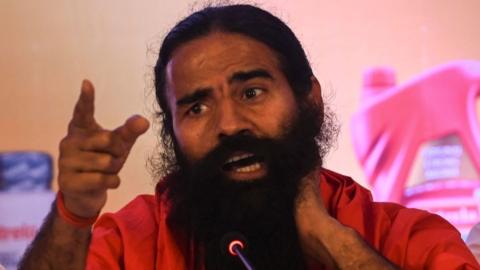 Indian yoga guru and non-executive director of Ruchi Soya Industries Limited (RSIL) Baba Ramdev speaks during an event for the announcement of the company's forthcoming Follow-on Public Offering (FPO) in Mumbai on March 21, 2022.
