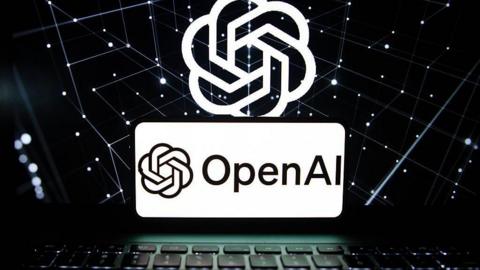 Library image of a laptop with the OpenAI logo above.
