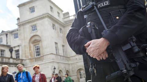 An armed police officer in London