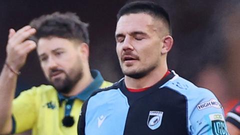 Ellis Jenkins is shown a red card