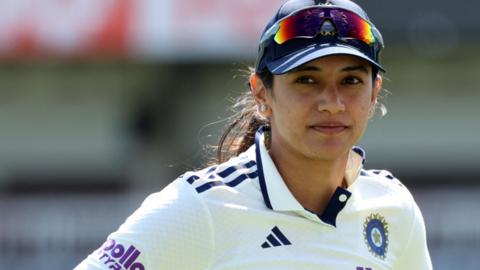Smriti Mandhana looks on