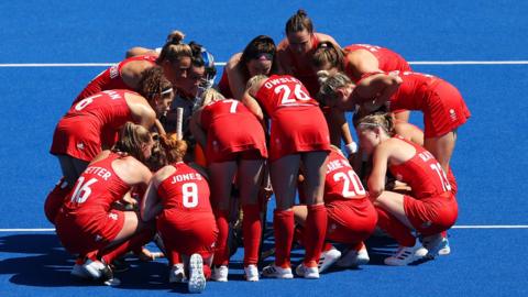 Great Britain's women's hockey team huddle