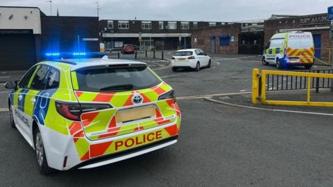 Police at a stabbing near Bury Market