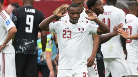 Assim Madibo of Qatar shocked after the injury to Ismael Kone of Canada 
