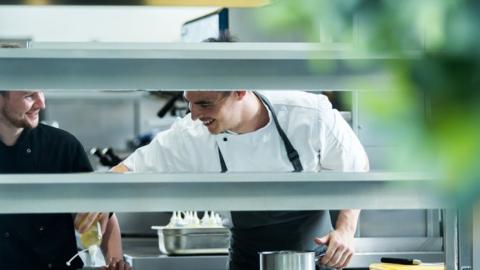 Andrew Sheridan and staff member working in the kitchen at Sosban in Llanelli