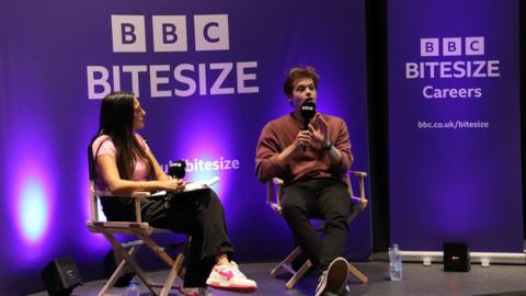 Two people sat talking infront of the ÃÛÑ¿´«Ã½ Bitesize Careers logo.