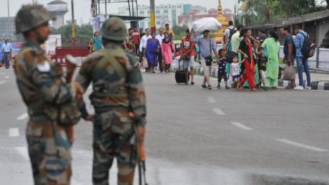 Army personnel stand guard during restrictions on August 5, 2019 in Jammu, India.