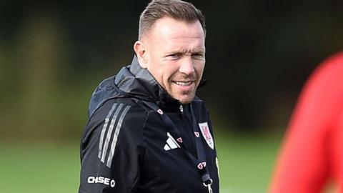 Craig Bellamy smiles in Wales training