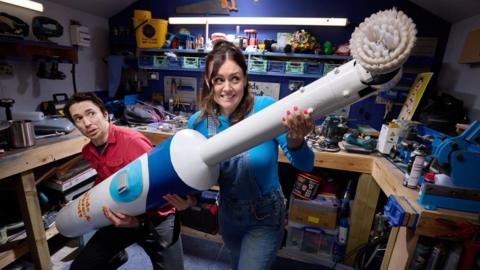 Ruth Amos and Shawn Brown with the record-breaking toothbrush