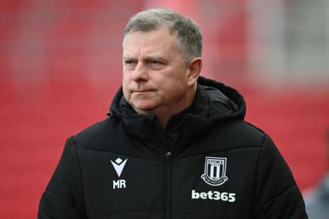 Stoke City boss Mark Robins looks on from the touchline