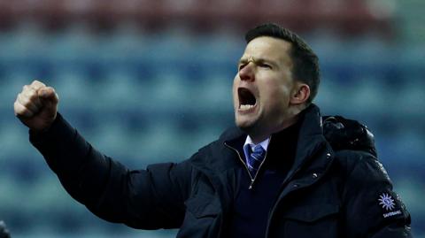 Gary Caldwell celebrates after the 1-0 win over Luton
