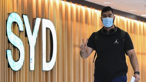 A passenger arrives at Sydney airport.