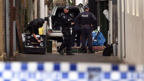 Police search for evidence at a home in Sydney