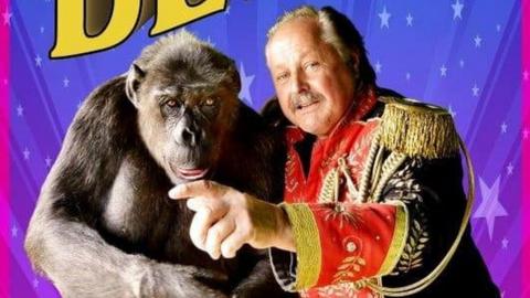 A poster of circus belly in which Robby performs. The chimp poses alongside ringmaster Klaus Köhler