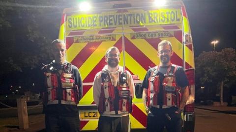 The SPB volunteers in high-vis vests in front of the charity's van