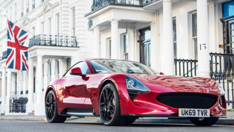 The TVR prototype parked with a union flag behind it