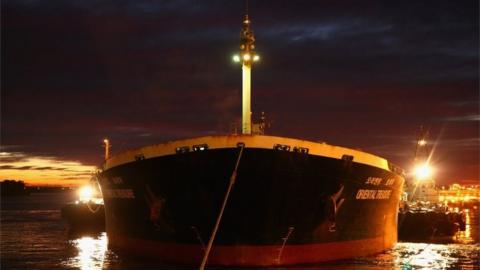 "Oriental Tresaure" bulk carrier ship with a mother line off the bow from Kooragang Island Coal Terminal through Newcastle Port