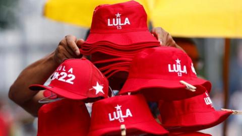 A vendor sells hats in support of presidential candidate Luiz Inácio Lula da Silva