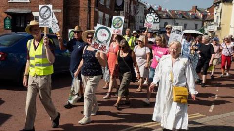 People marching the streets of Newent