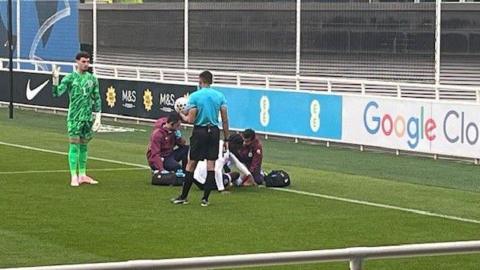 Ayden Heaven being treated on the pitch by physios