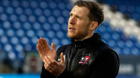 Dan Green claps the Exeter City supporters