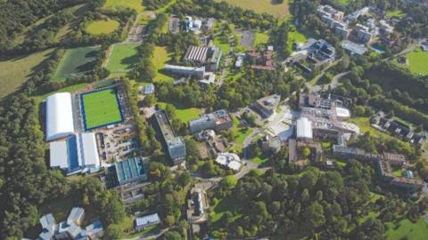 An aerial image of the University of Exeter campus surrounded by green fields
