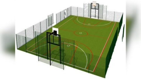 A graphic of how the pitches could look. They have a green surface with black metal fencing surrounding it. There are both football goals and basketball nets at either end.