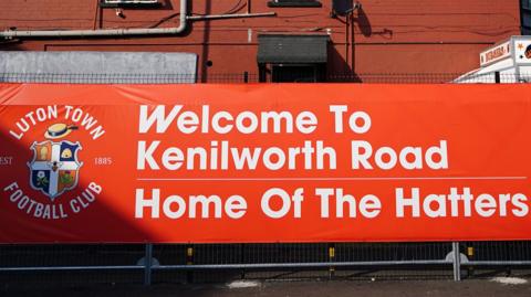 A banner outside Luton Town's Kenilworth Road home