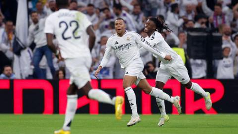 Real Madrid players celebrate against Sevilla