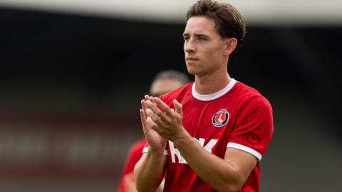 Terry Taylor applauds the Charlton supporters following a game in 2024