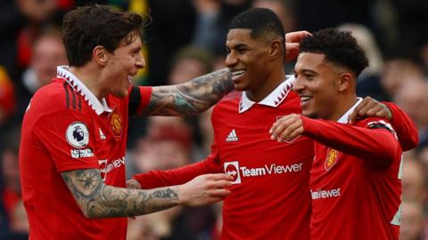 Manchester United's players celebrate scoring in a Premier League match against Leicester City