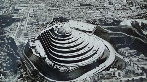 El Helicoide seen from above towering over the buildings of Caracas