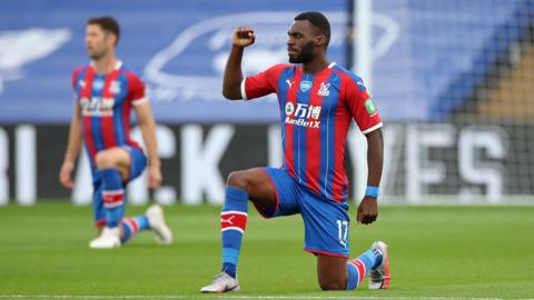 Christian Benteke takes the knee