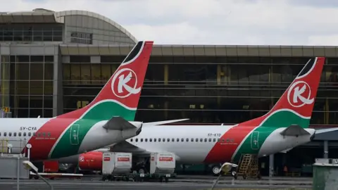 This photograph taken on November 5, 2022, shows Kenya Airways planes at the parking bay, amid a strike by pilots organised by Kenya Airline Pilots Association (KALPA)