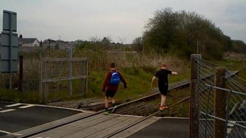 File photo showing children on rail tracks