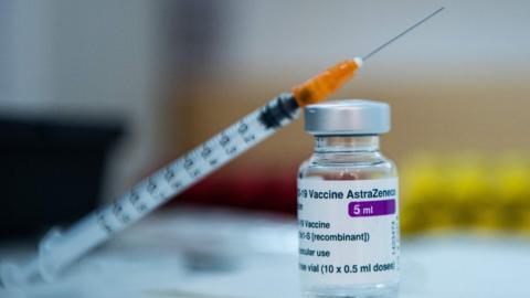 A syringe on a vial of AstraZeneca anti-Covid-19 vaccine