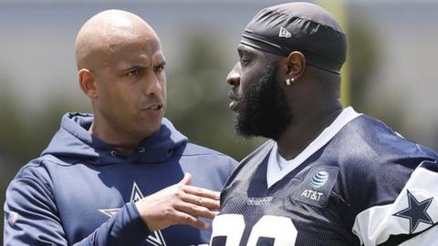 Aden Durde speaks to Dallas Cowboys' defensive tackle Neville Gallimore