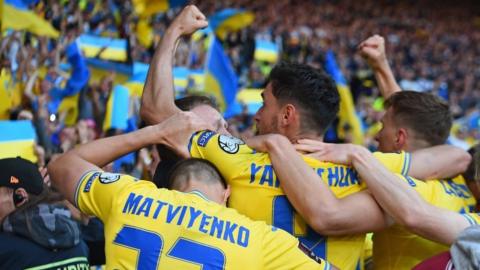 Ukraine players celebrate beating Scotland