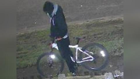 CCTV image of person on a bike