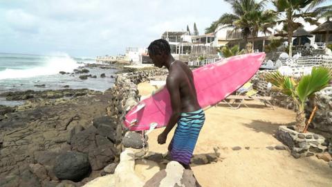 Pape Diouf goes surfing in Senegal
