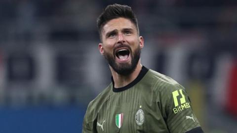 Olivier Giroud celebrates a goal for AC Milan