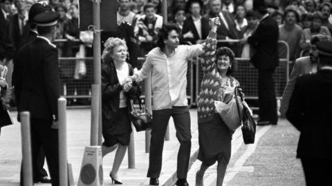 Gerry Conlon, accompanied by his sisters, walks free from the Old Bailey after being cleared of all charges