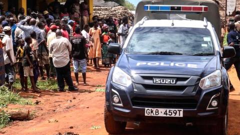 Police car in front of crowd