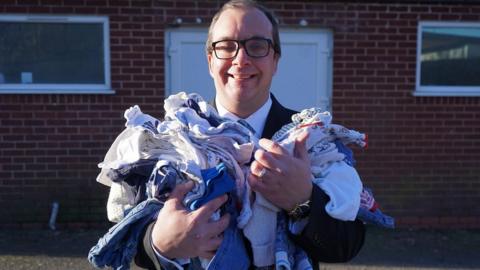 Cllr Rick Deller with some of the items on offer