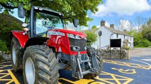 Tractor parked outside pub