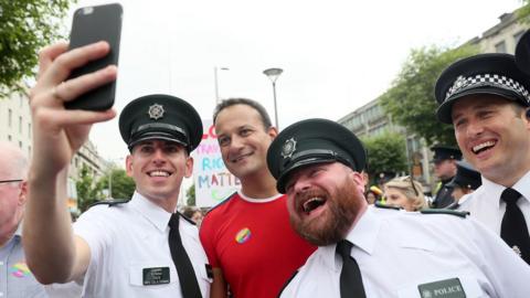 Irish prime minister Leo Varadkar poses for a photo with PSNI officers ahead of the start of the Pride parade in Dublin