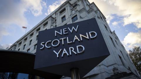 The New Scotland Yard sign and building, the headquarters of the the Metropolitan Police, the police force responsible for policing the boroughs of London on the 15th of November 2023, Westminster, London