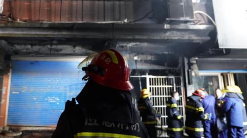 This photo taken on Jan. 24, 2024 shows the exterior view of the building where a fire broke out in Xinyu City, east China's Jiangxi Province.