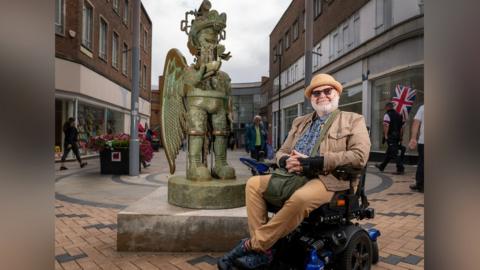 Jason Wilsher-Mills with his statue of an Amazonian love god