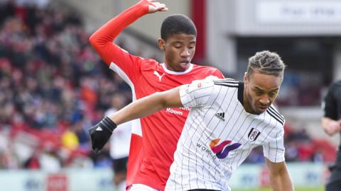 Remy Vita of Barnsley tackles Bobby Reid of Fulham